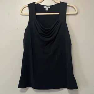 Pretty sleeveless blouse with silver embezzlements. Size small